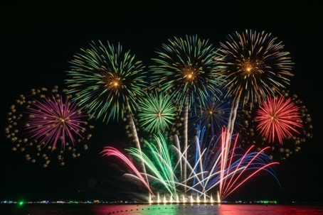 Fireworks over water.